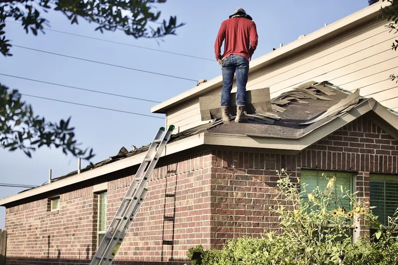 Professional roofer working on a residential roof in New Whiteland